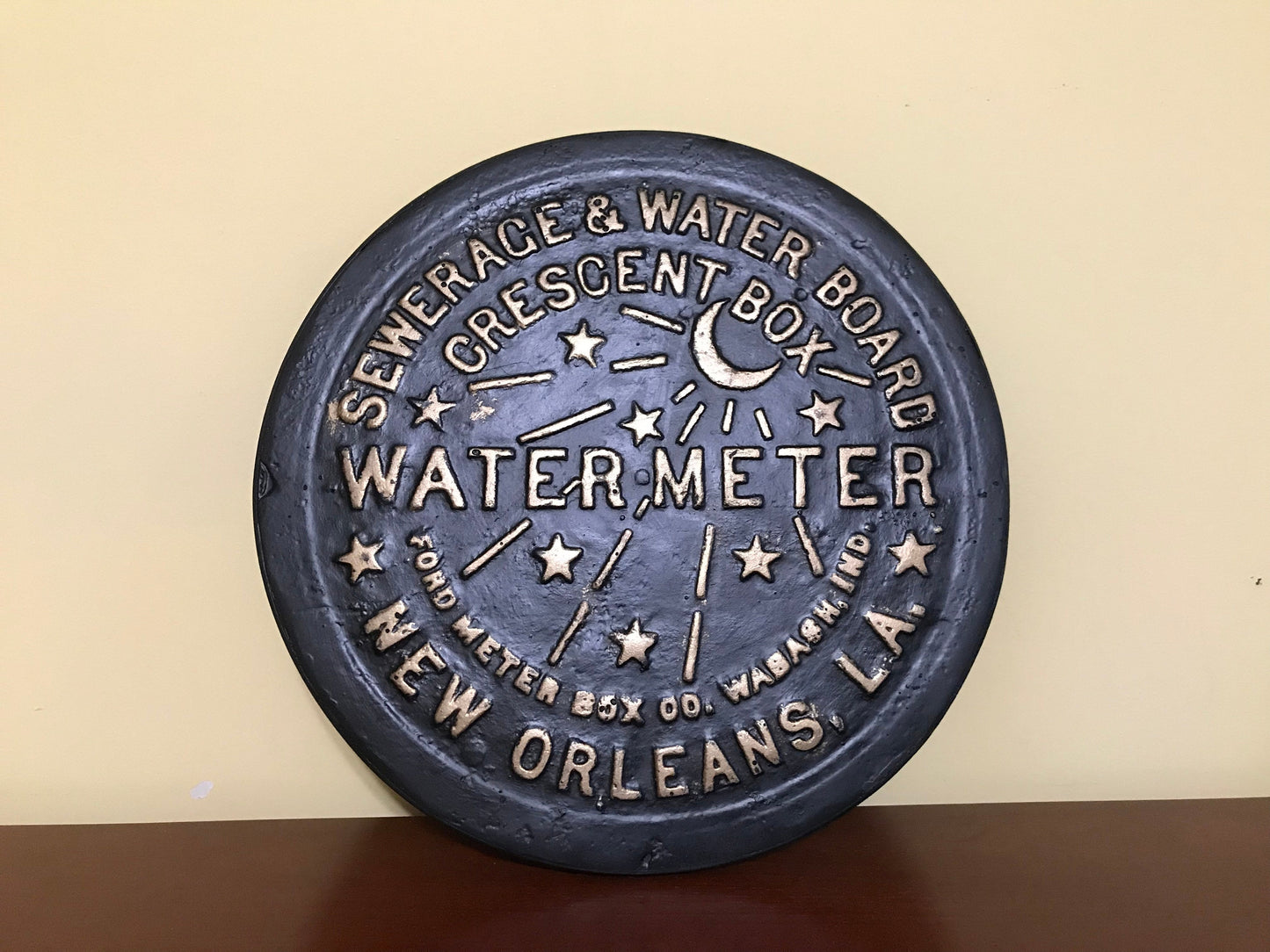 Unique wall art, famed, vintage New Orleans water meter cover