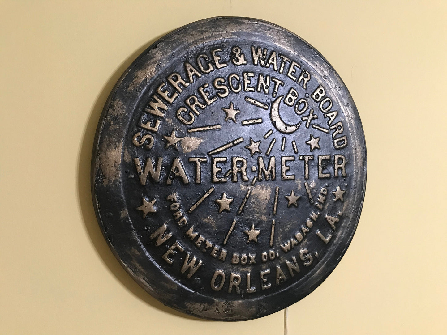 Unique wall art, famed, vintage New Orleans water meter cover