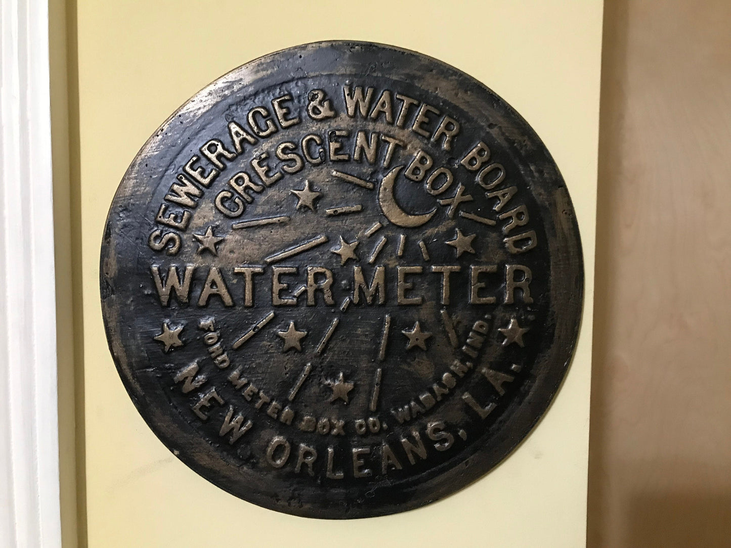 Unique wall art, famed, vintage New Orleans water meter cover