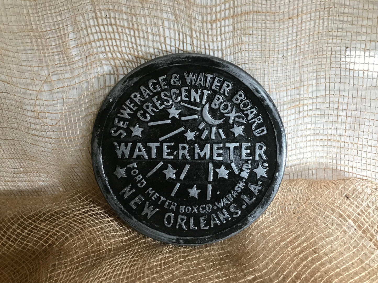 Unique wall art, famed, vintage New Orleans water meter cover