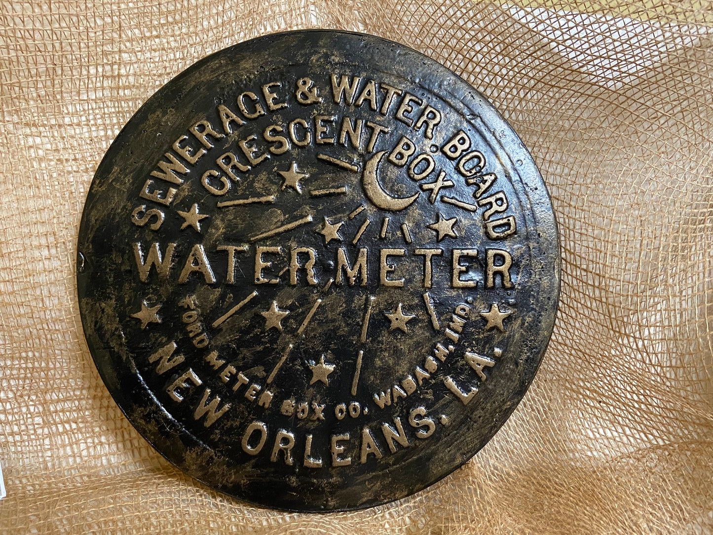 Unique wall art, famed, vintage New Orleans water meter cover