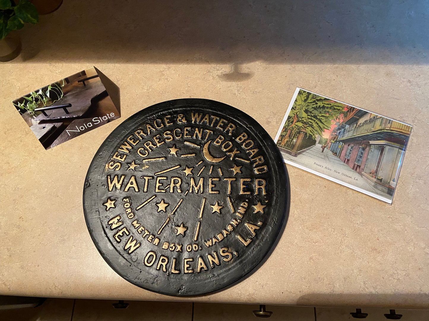 Unique wall art, famed, vintage New Orleans water meter cover