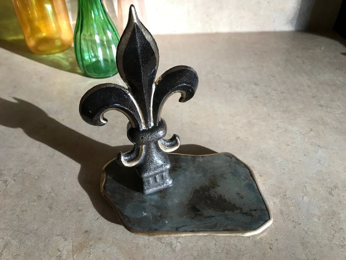 Hand painted cast iron Fleur de Lis mounted on vintage weathered slate, sealed with high gloss clear epoxy finish