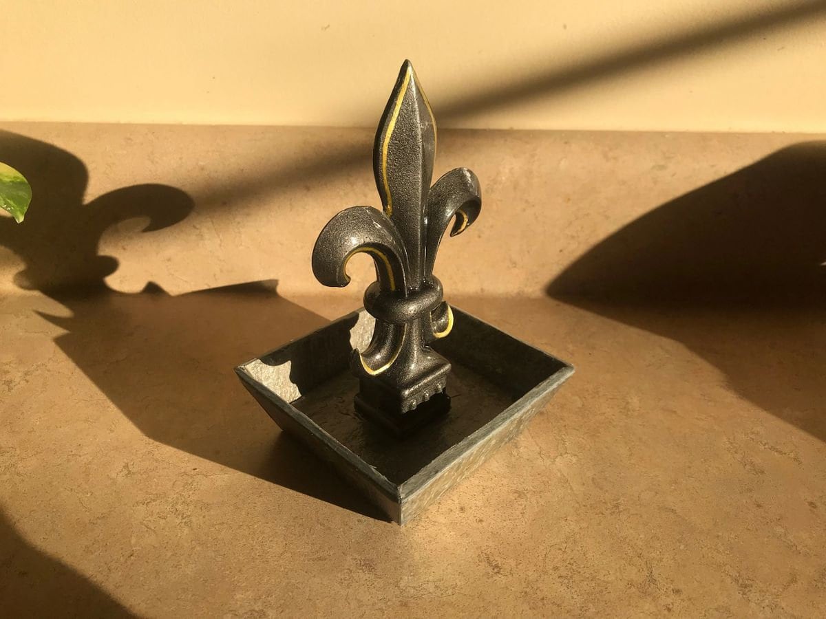 New Orleans theme, hand painted cast iron finial mounted in a slate tray base.