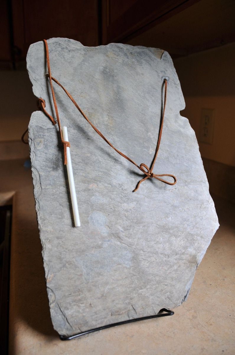 Vintage, weathered slate chalkboard with three soapstone pencils, leather strung for wall hanging. Makes a unique gift.